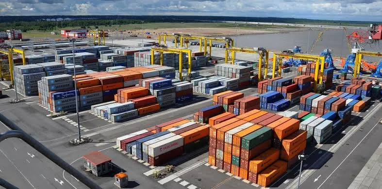 Export hub container yard with mixed cargo stacked in tiers