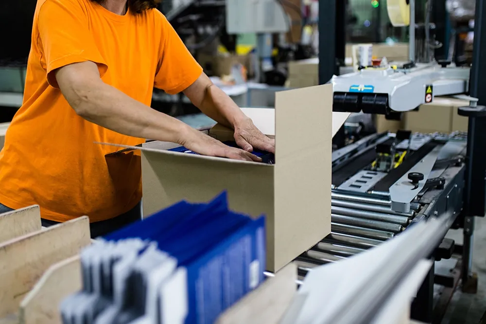 Essential prerequisites for packaging quality approval: calibrated scale, tape samples, and master carton on the inspection bench