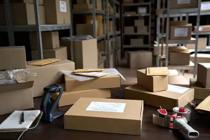 Unbranded cartons being labelled and packed for a private-label dispatch