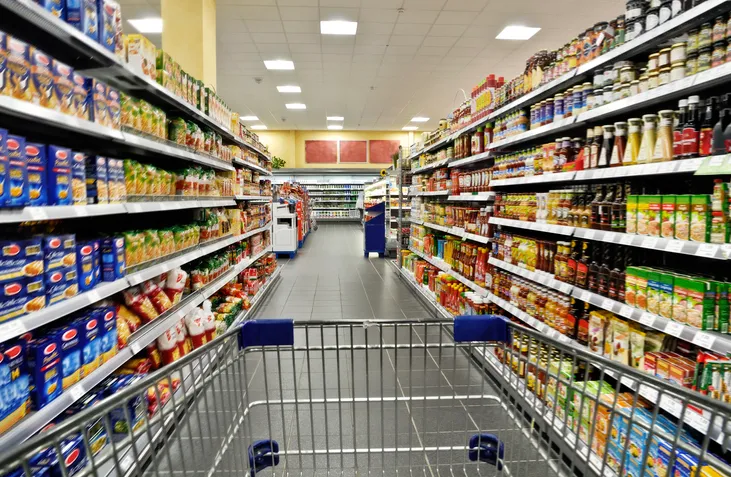A supermarket aisle of packaged grocery stock on the shelves